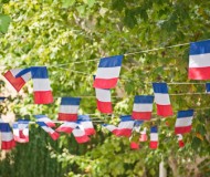 French flags garland decorating a village square